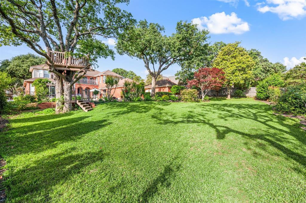 2906 Edgewood Lane Colleyville, TX 76034 - Photo 39 of 40 a backyard of a house with lots of green space