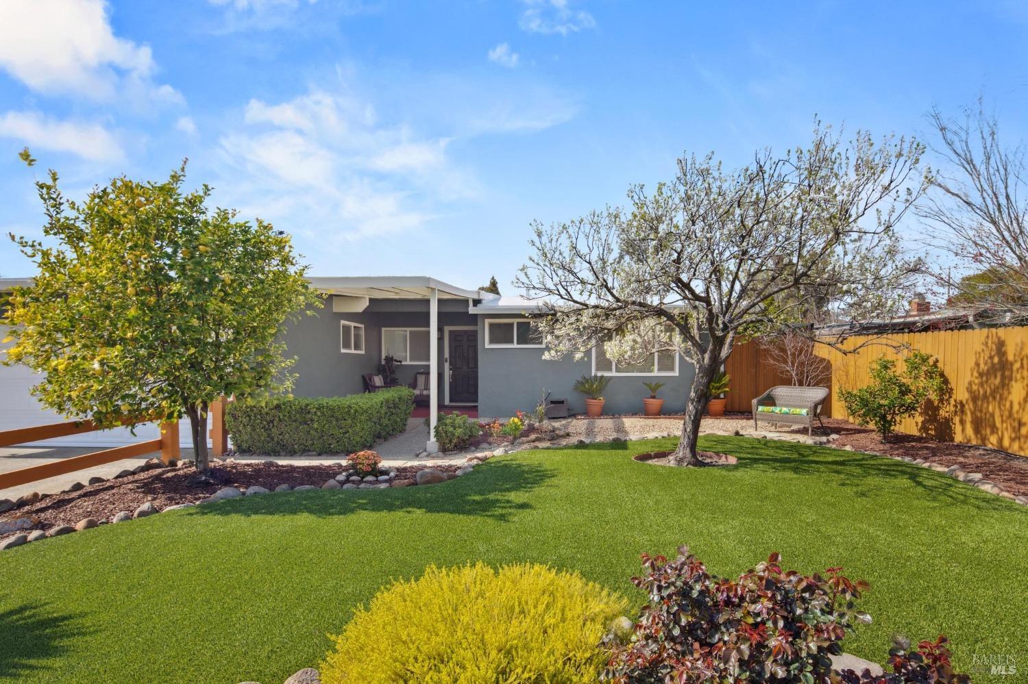 815 Rosal Way San Rafael, CA 94903 - Photo 1 of 1 a front view of a house with a garden and trees