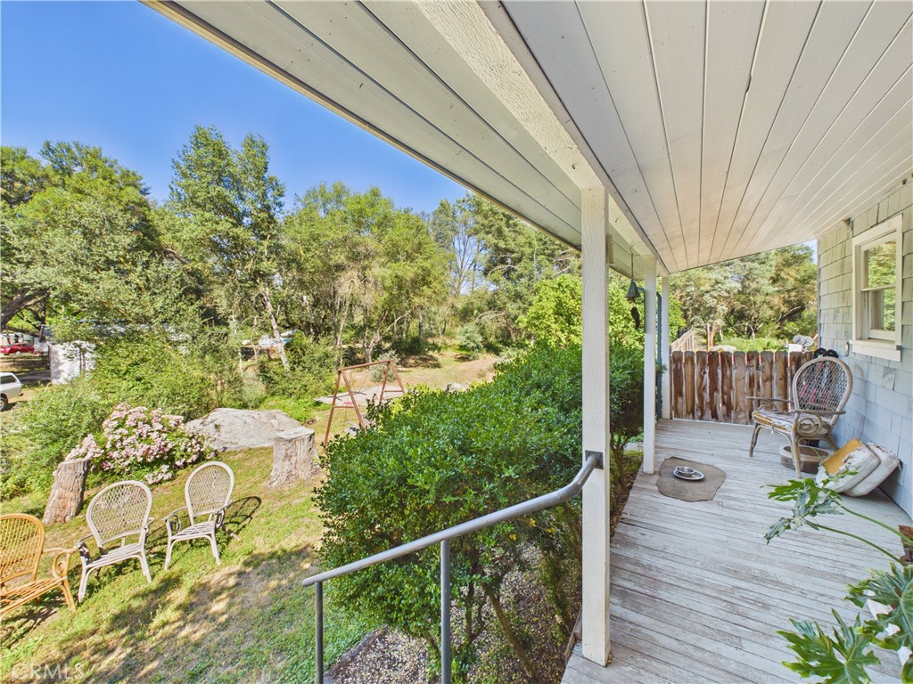 4208 Ramsden Road Mariposa, CA 95338 - Photo 26 of 42 a view of a balcony with chair and wooden floor