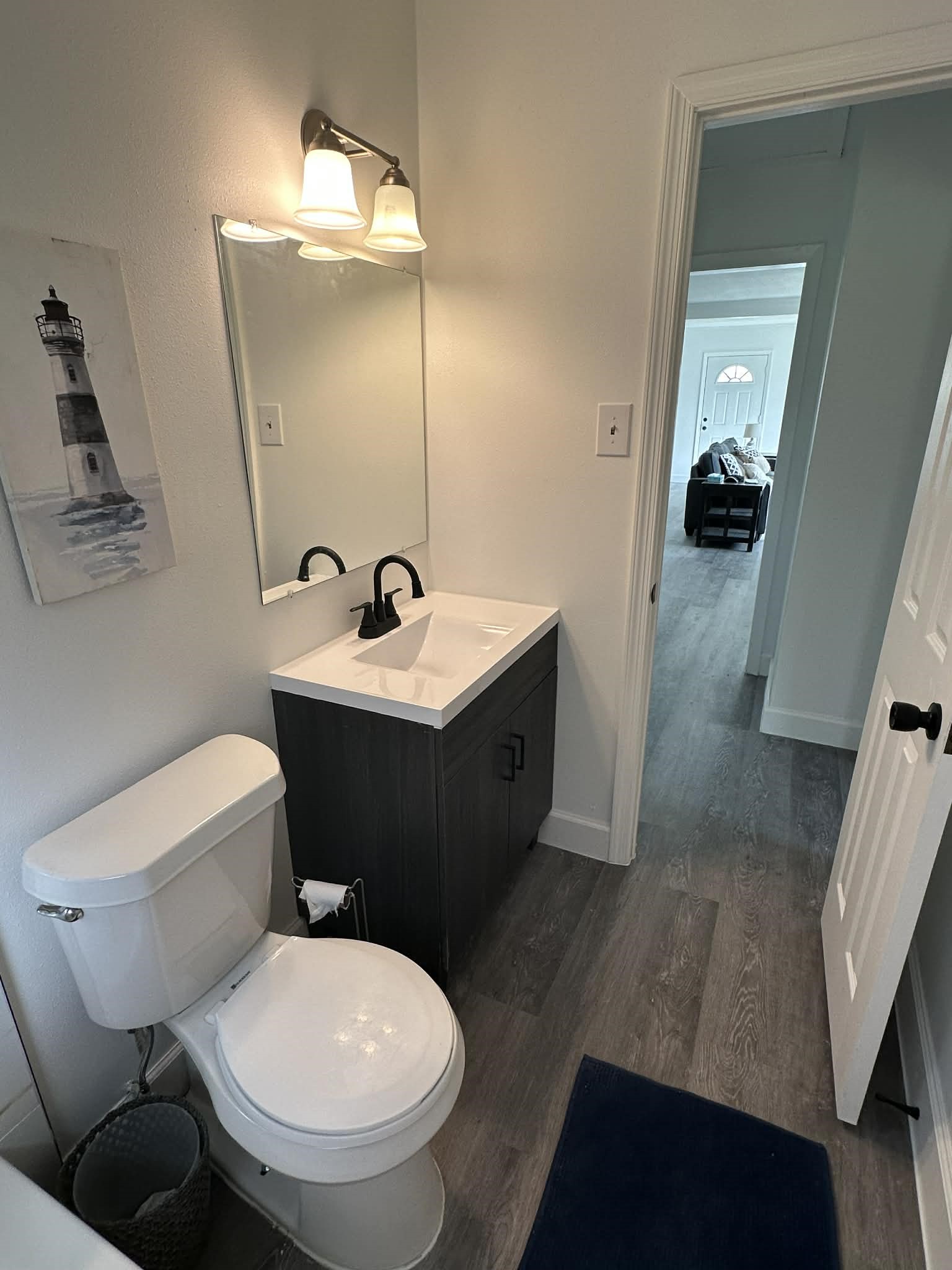 614 Fm 1406 Road Winnie, TX 77665 - Photo 11 of 25 a bathroom with a toilet sink and mirror