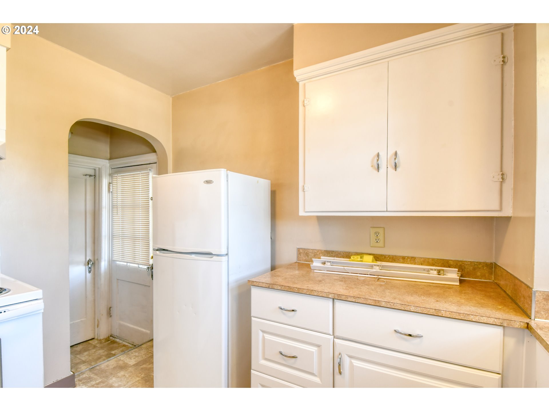 1016 Southwest Goodwin Place Pendleton, OR 97801 - Photo 12 of 36 a kitchen with a refrigerator and a sink