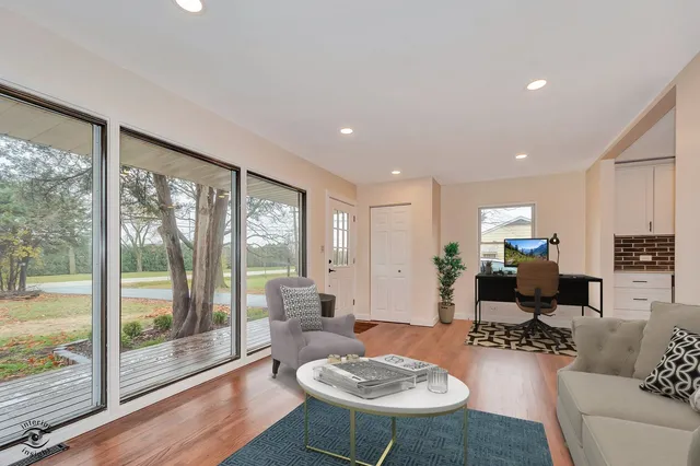 a living room with furniture and a large window