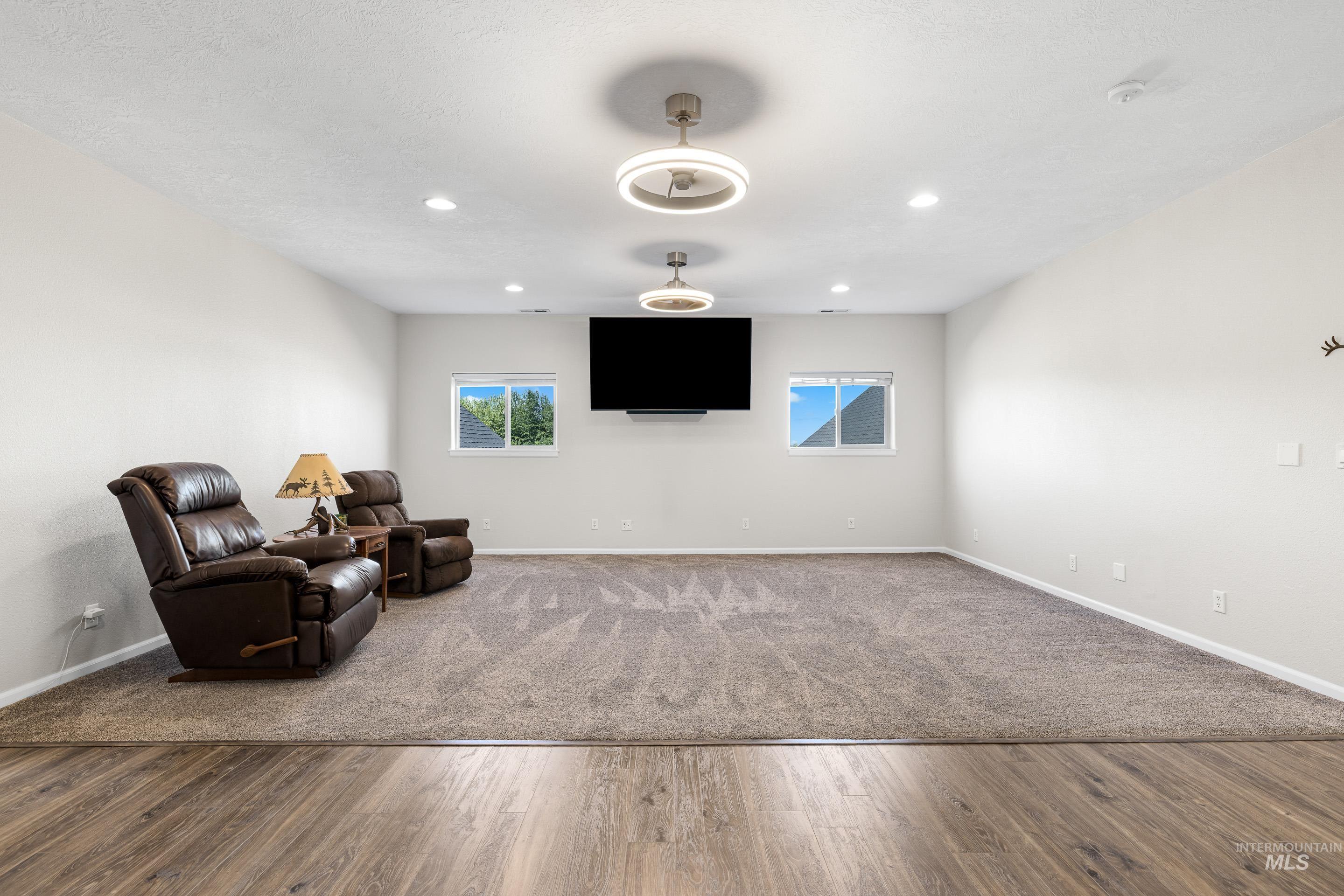 14119 Silver Ridge Road Caldwell, ID 83607 - Photo 28 of 50 Sitting room featuring dark wood-type flooring, recessed lighting, and dark colored carpet