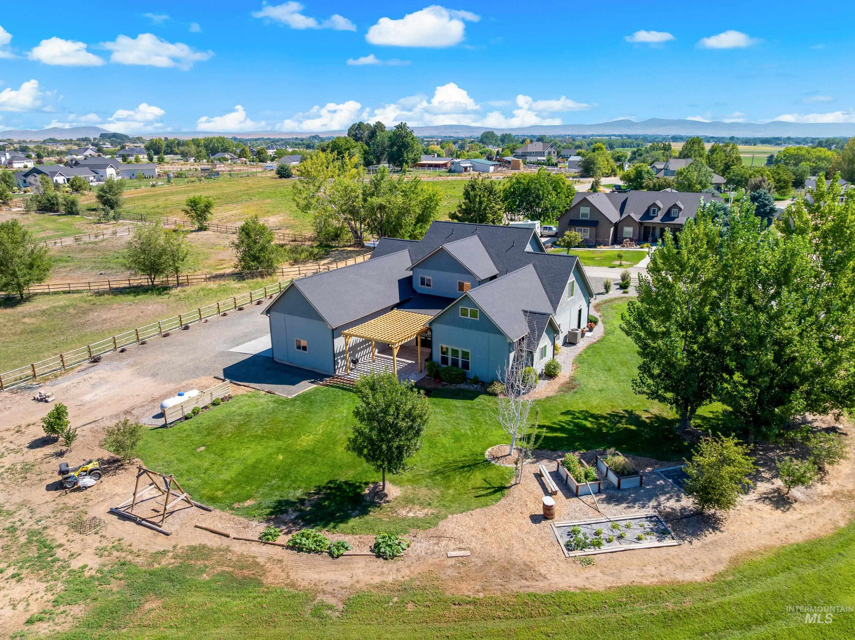 14119 Silver Ridge Road Caldwell, ID 83607 - Photo 3 of 50 Aerial view of sparsely populated area featuring a mountainous background