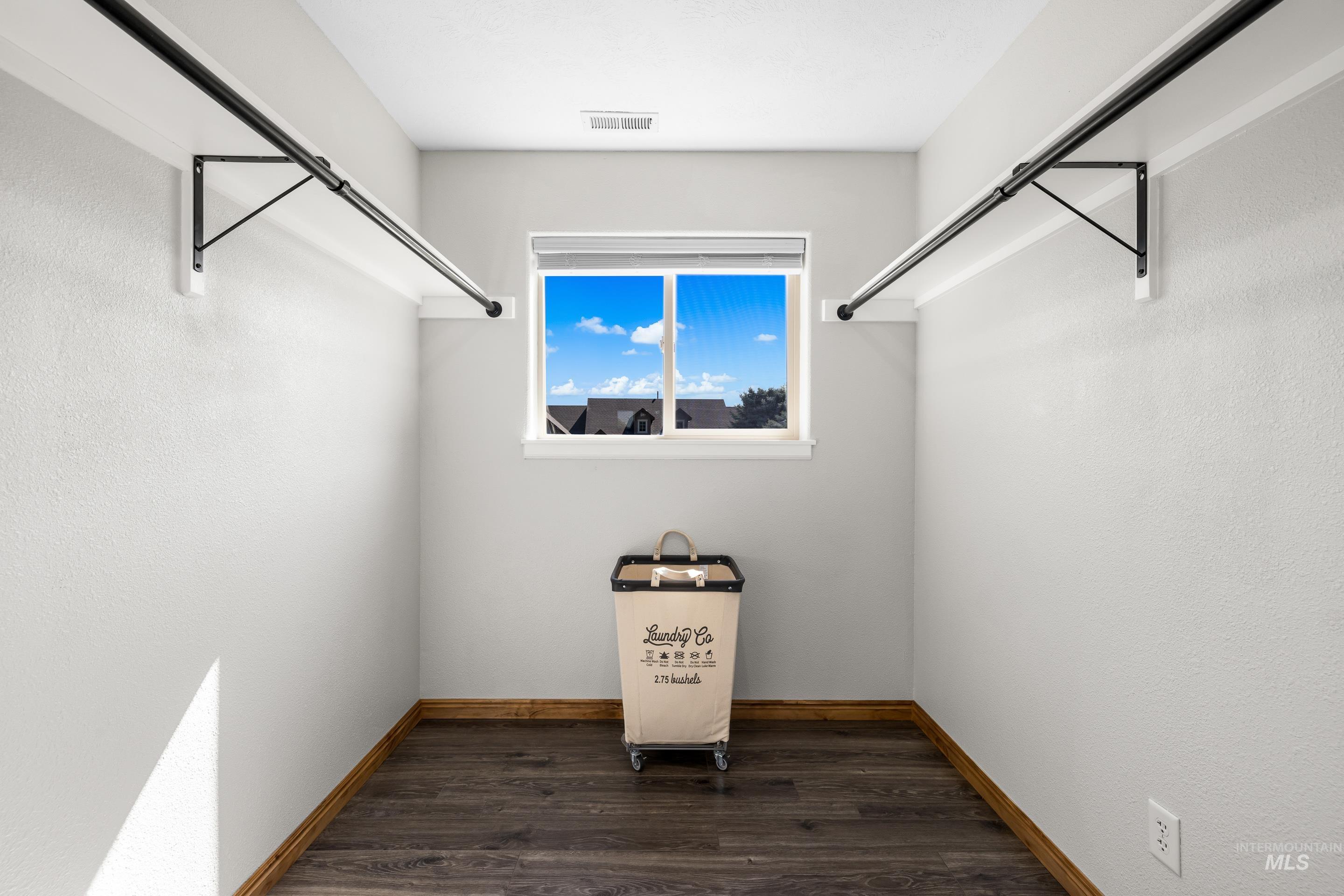 14119 Silver Ridge Road Caldwell, ID 83607 - Photo 41 of 50 Spacious closet with dark wood-style floors