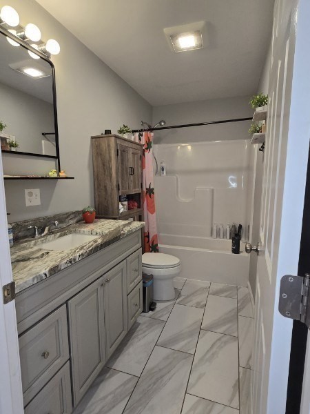 83 Comins Pond Road Warren, MA 01083 - Photo 12 of 29 a bathroom with a sink a toilet and shower