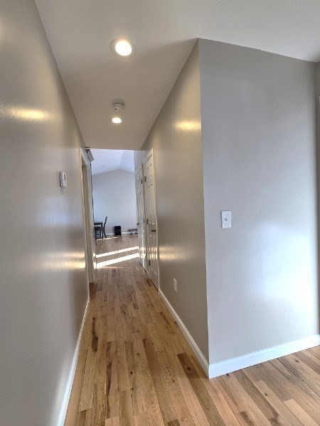 83 Comins Pond Road Warren, MA 01083 - Photo 13 of 29 a view of a hallway with wooden floor