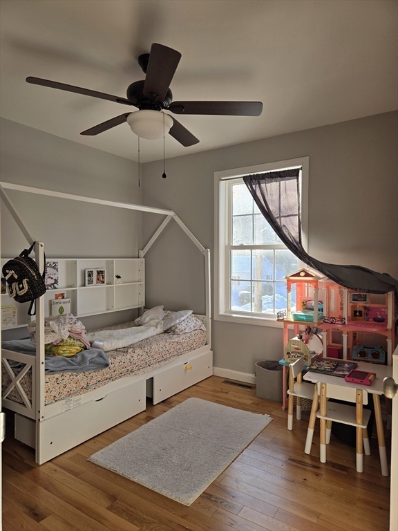 83 Comins Pond Road Warren, MA 01083 - Photo 14 of 29 a bedroom with a bed and a bookshelf