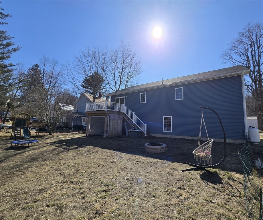 83 Comins Pond Road Warren, MA 01083 - Photo 28 of 29 a front view of a house with a yard