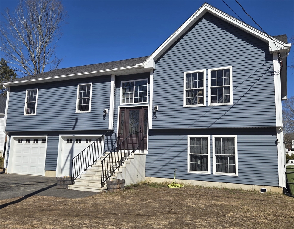 83 Comins Pond Road Warren, MA 01083 - Photo 3 of 29 a view of a house with a patio