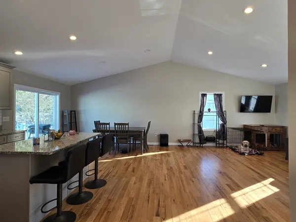 a open kitchen with a table and chairs in it