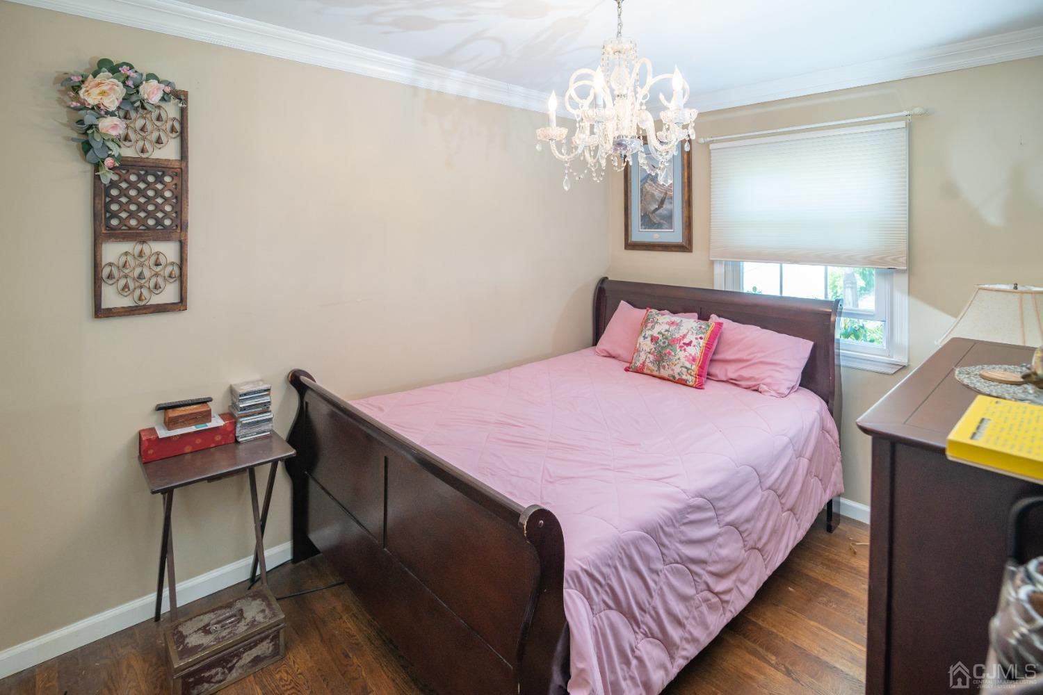 18 Columbia Road Old Bridge, NJ 08859 - Photo 11 of 24 a bedroom with a bed and a chandelier