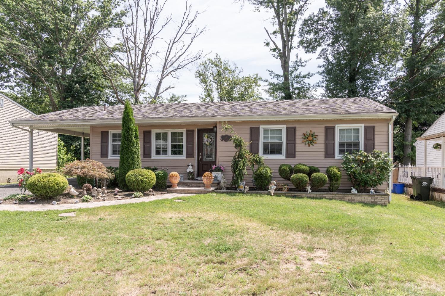 18 Columbia Road Old Bridge, NJ 08859 - Photo 16 of 24 a front view of a house with swimming pool and porch