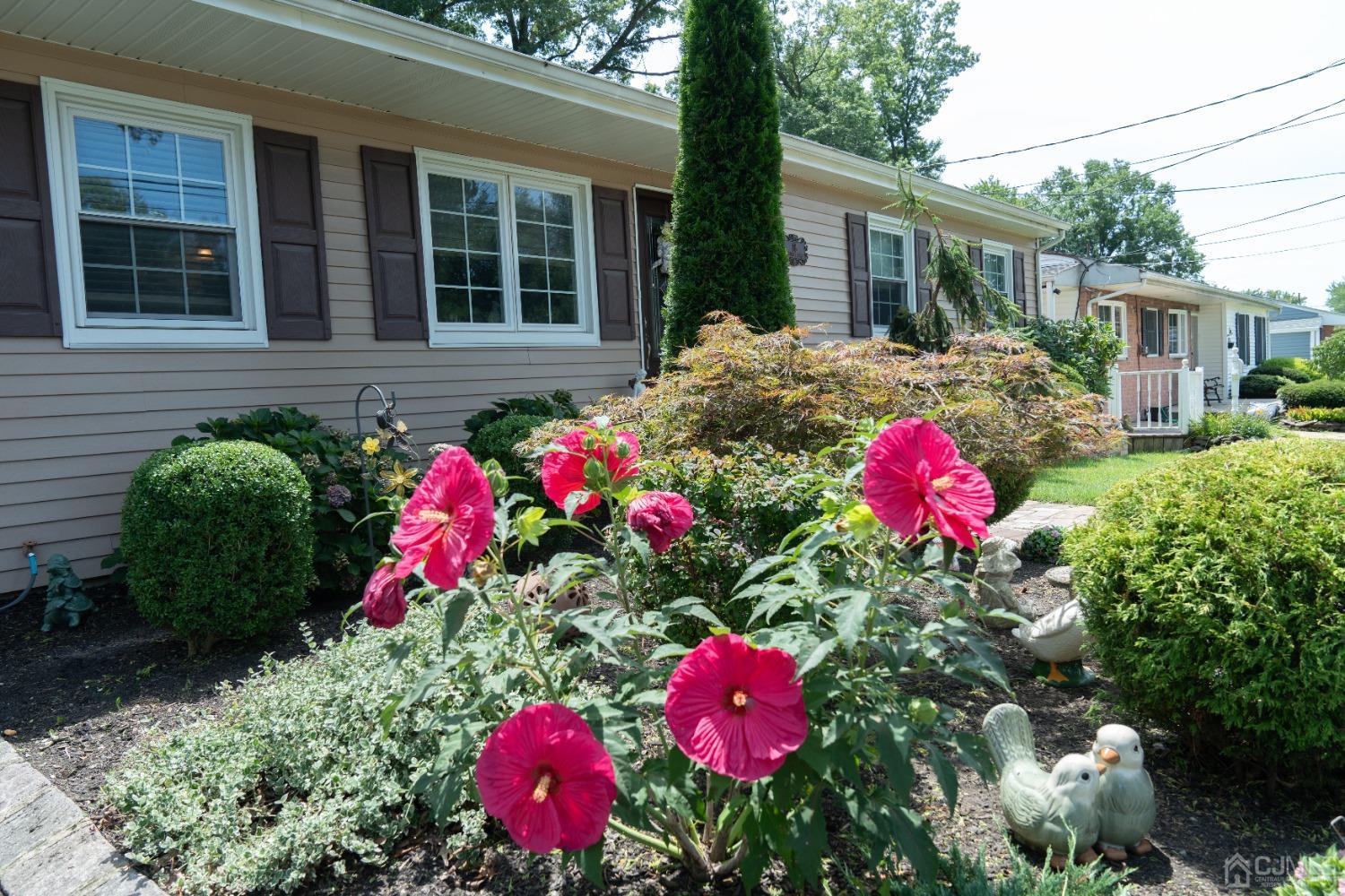 18 Columbia Road Old Bridge, NJ 08859 - Photo 19 of 24 a view of a house that has a lot of flower plants