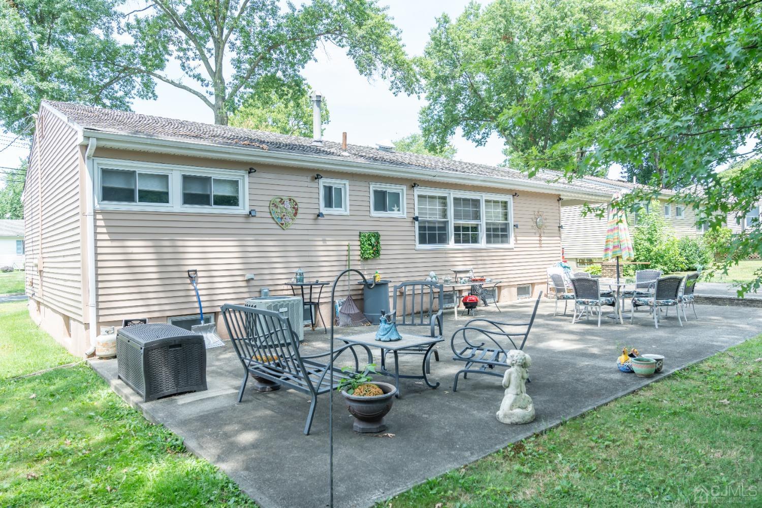 18 Columbia Road Old Bridge, NJ 08859 - Photo 22 of 24 a view of backyard of house with outdoor seating