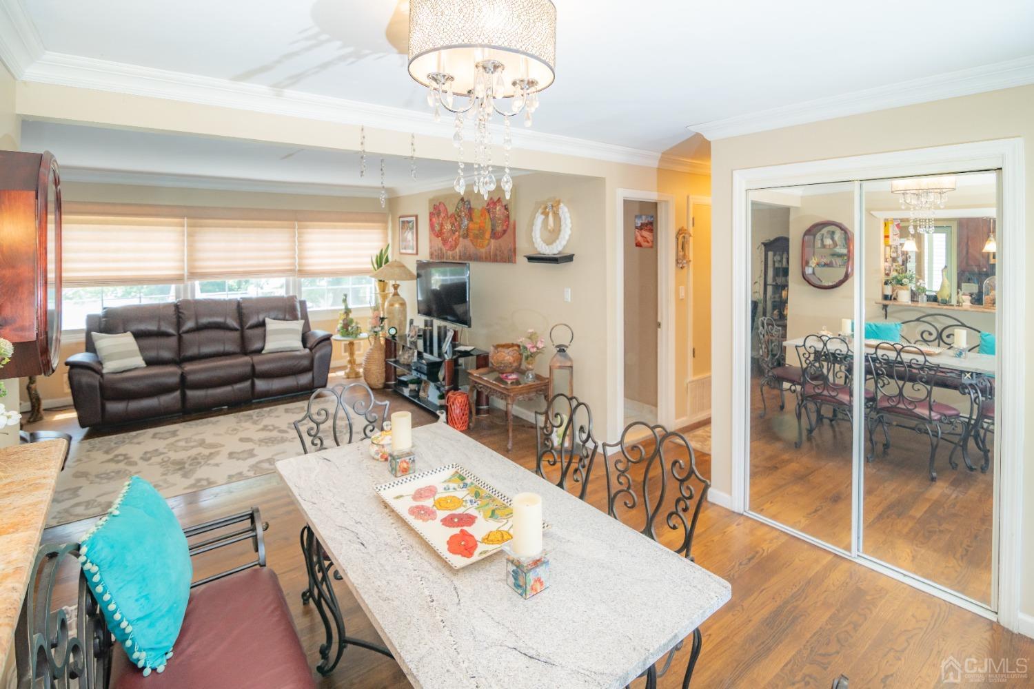 18 Columbia Road Old Bridge, NJ 08859 - Photo 5 of 24 a view of a dining room with furniture a chandelier and wooden floor