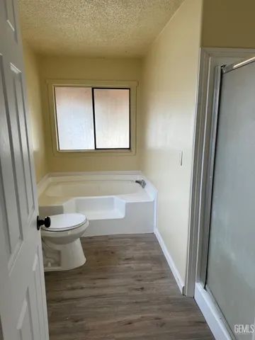 a bathroom with a bathtub toilet and sink