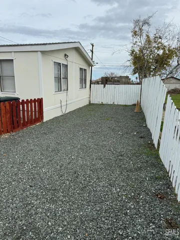 a view of backyard and deck