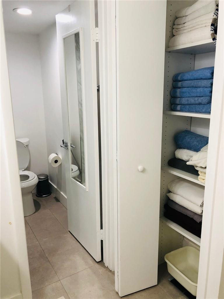 310 Racquet Club Road, Unit 101 Weston, FL 33326 - Photo 26 of 31 a bathroom with a toilet
