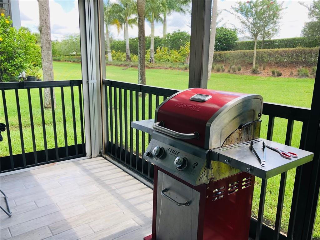 310 Racquet Club Road, Unit 101 Weston, FL 33326 - Photo 28 of 31 a view of a balcony with furniture
