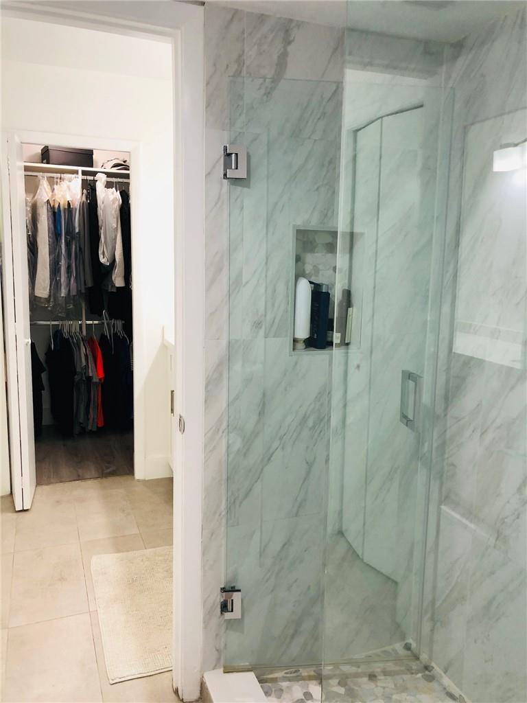 310 Racquet Club Road, Unit 101 Weston, FL 33326 - Photo 3 of 31 a bathroom with a shower
