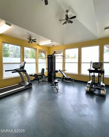 a room with gym equipment and a large window