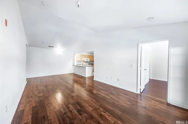 an empty room with wooden floor