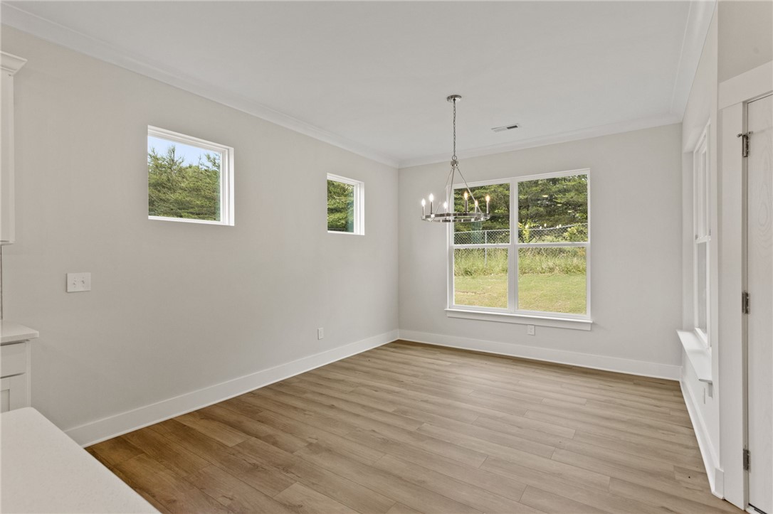 315 Old Shirley Road Central, SC 29630 - Photo 15 of 26 This bright dining area features ample natural light and durable flooring, perfect for everyday living.