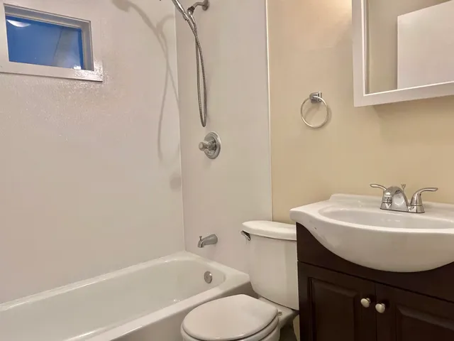 a bathroom with a sink toilet and a bathtub