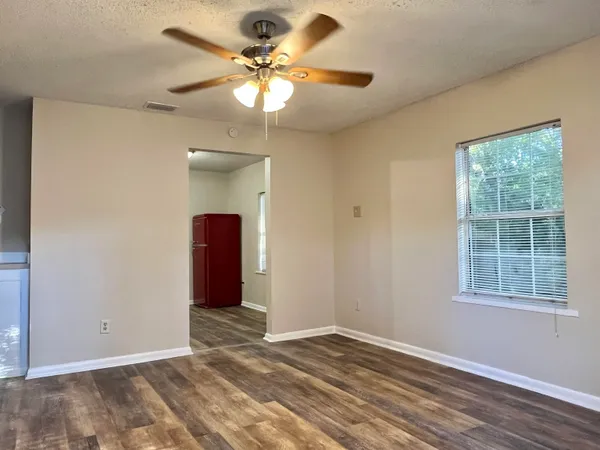a view of an empty room with a window