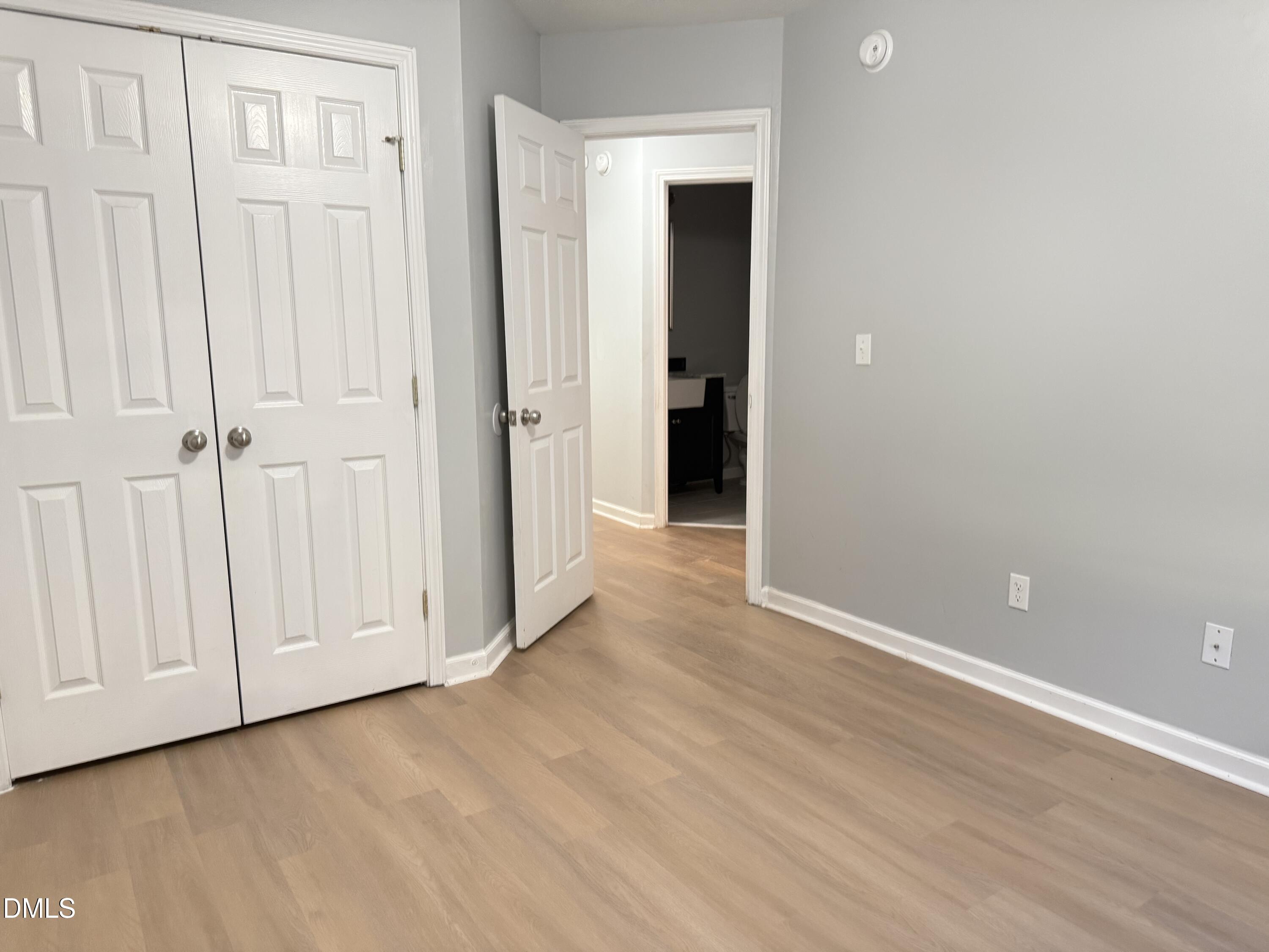 1206 Maroon Drive Durham, NC 27713 - Photo 16 of 20 an empty room with wooden floor