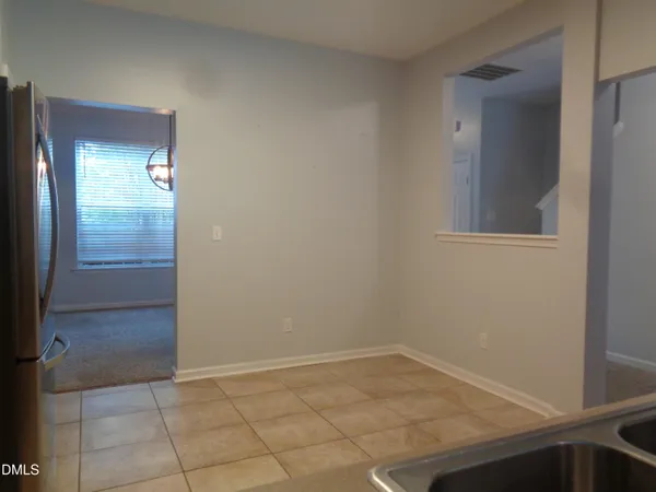 an empty room with mirror