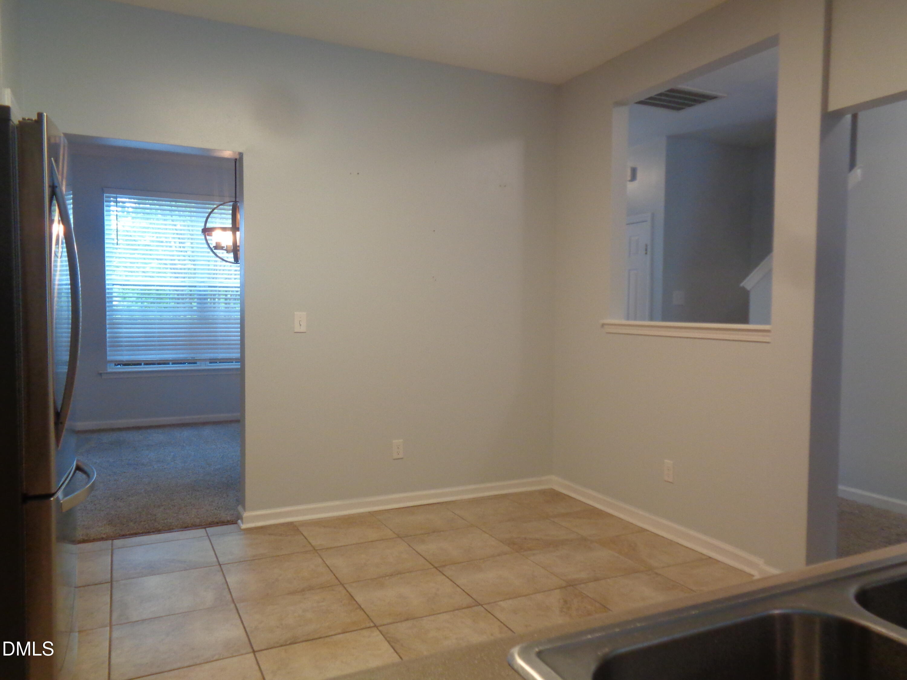 1206 Maroon Drive Durham, NC 27713 - Photo 9 of 20 an empty room with mirror