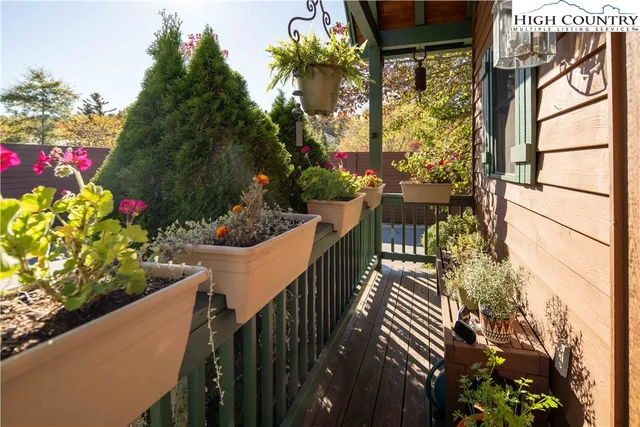 a view of a house with a flower garden