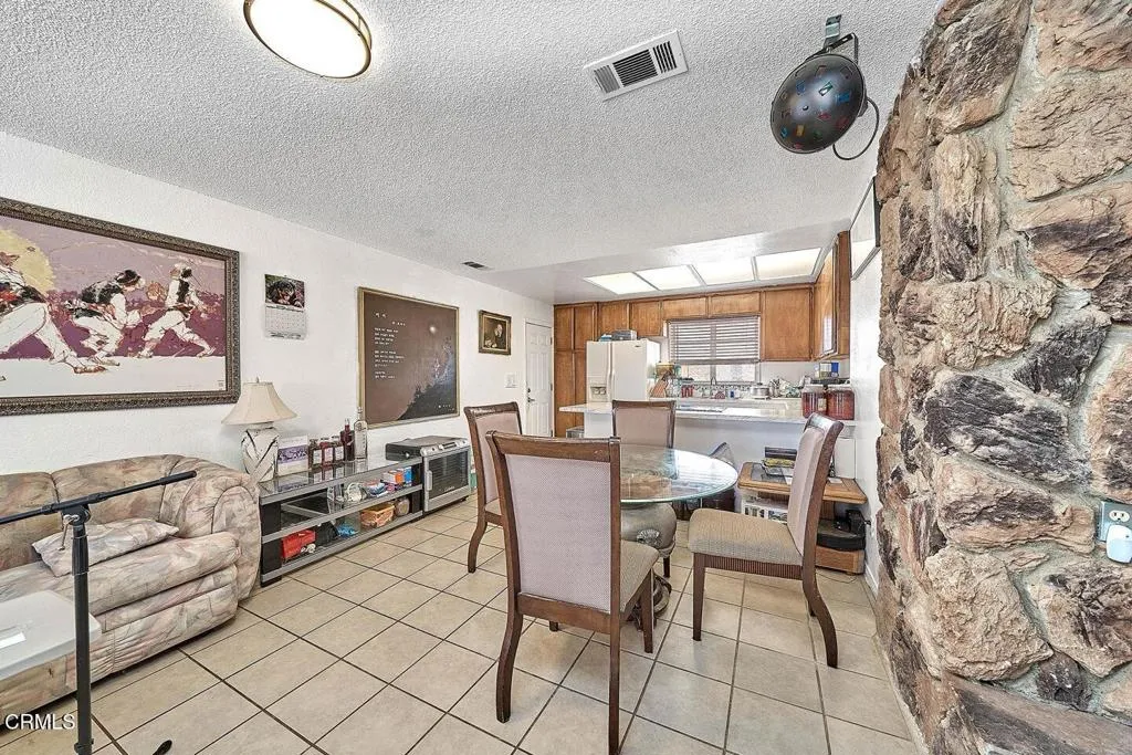 9125 Mesa Road Lucerne Valley, CA 92356 - Photo 12 of 55 a dining room with furniture and window