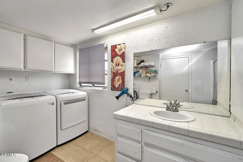 9125 Mesa Road Lucerne Valley, CA 92356 - Photo 22 of 55 a utility room with dryer and washer