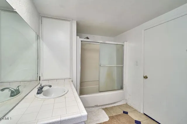 a bathroom with a sink and a tub