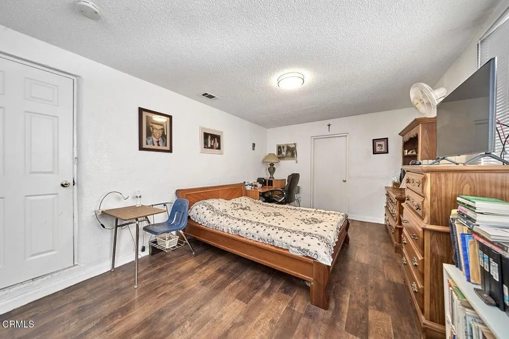 9125 Mesa Road Lucerne Valley, CA 92356 - Photo 25 of 55 a living room with furniture and a flat screen tv