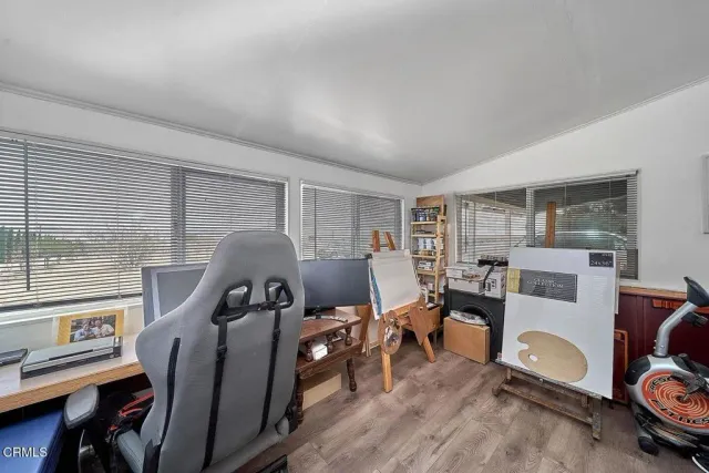 a view of a workspace with furniture and a livingroom