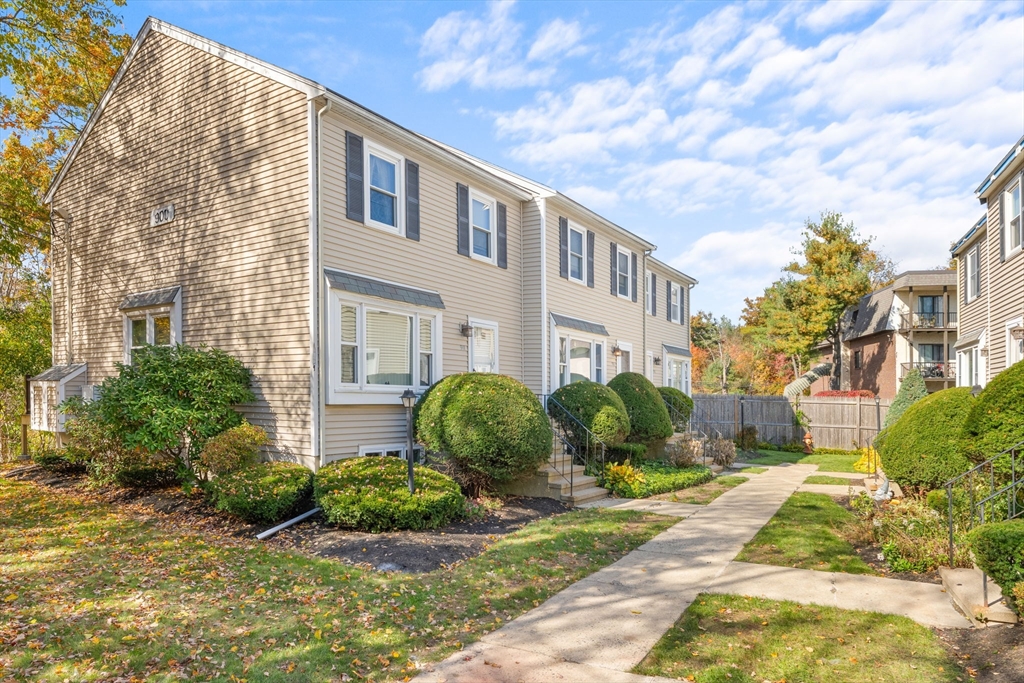 902 Irving Road, Unit 902 Randolph, MA 02368 - Photo 22 of 22 a front view of a house with garden