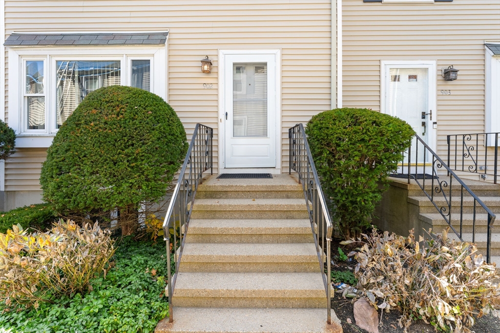 902 Irving Road, Unit 902 Randolph, MA 02368 - Photo 4 of 22 a view of a potted plants next to a house