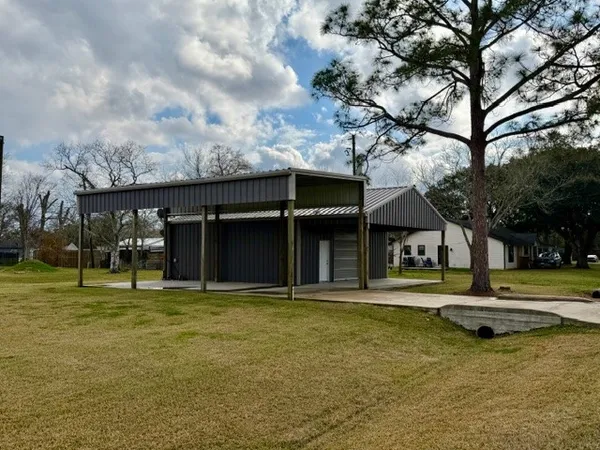 a view of a large building with a large tree