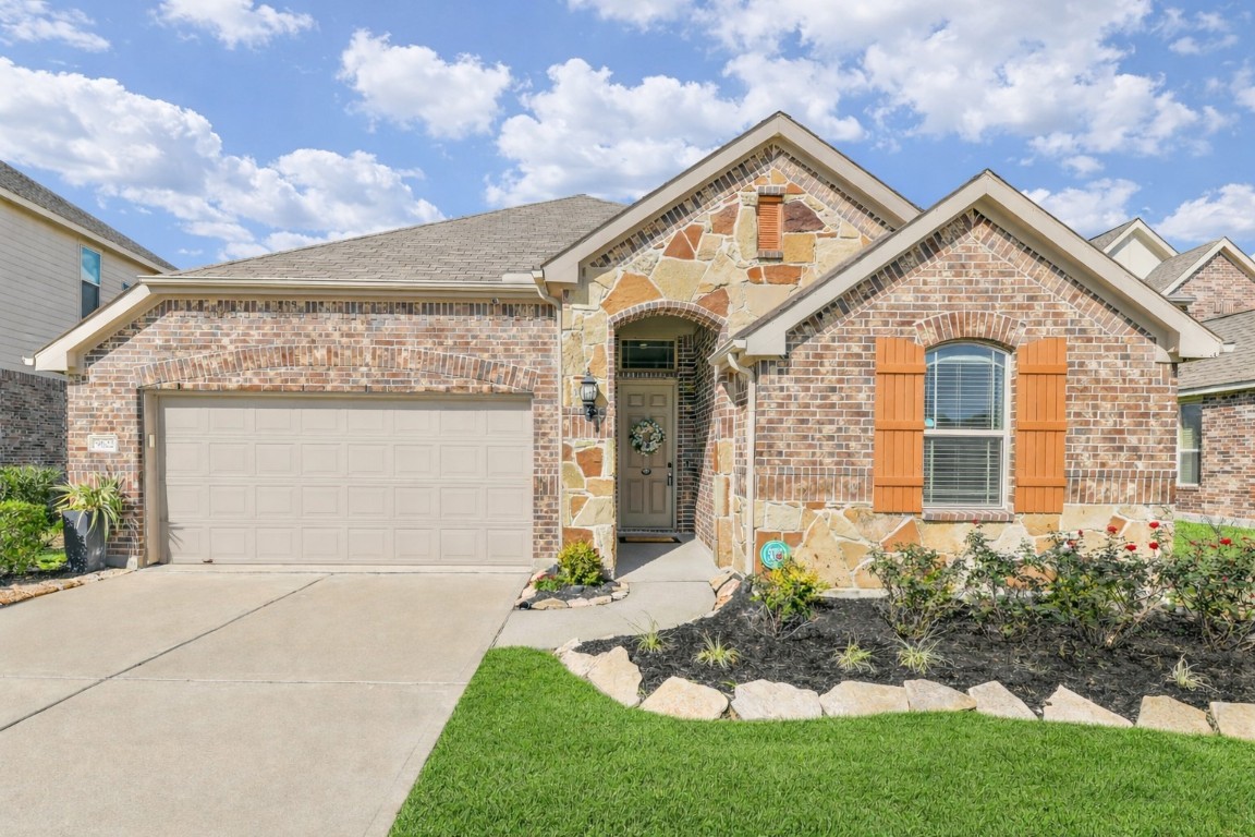 9622 Invergarry Way Tomball, TX 77375 - Photo 1 of 32 a front view of a house with a yard and garage