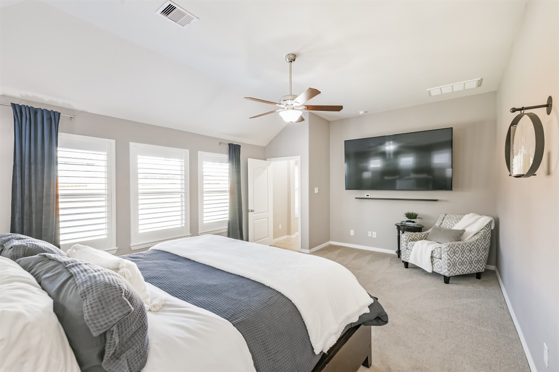 9622 Invergarry Way Tomball, TX 77375 - Photo 16 of 32 a bedroom with a bed and a flat screen tv