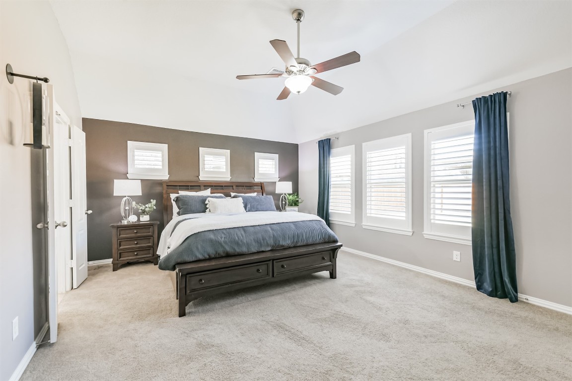 9622 Invergarry Way Tomball, TX 77375 - Photo 17 of 32 a spacious bedroom with a bed and window