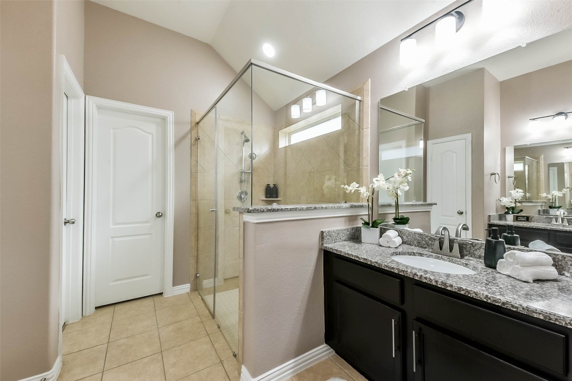 9622 Invergarry Way Tomball, TX 77375 - Photo 18 of 32 a bathroom with a granite countertop sink mirror and double