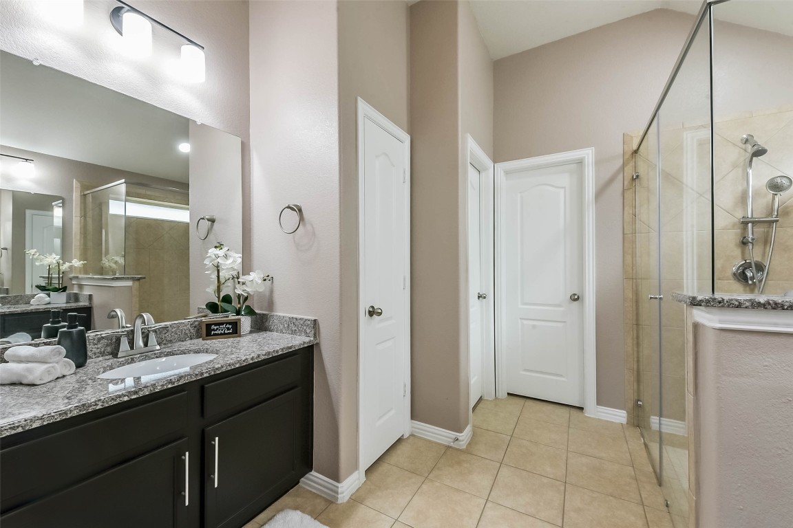 9622 Invergarry Way Tomball, TX 77375 - Photo 19 of 32 a bathroom with a granite countertop shower sink and mirror