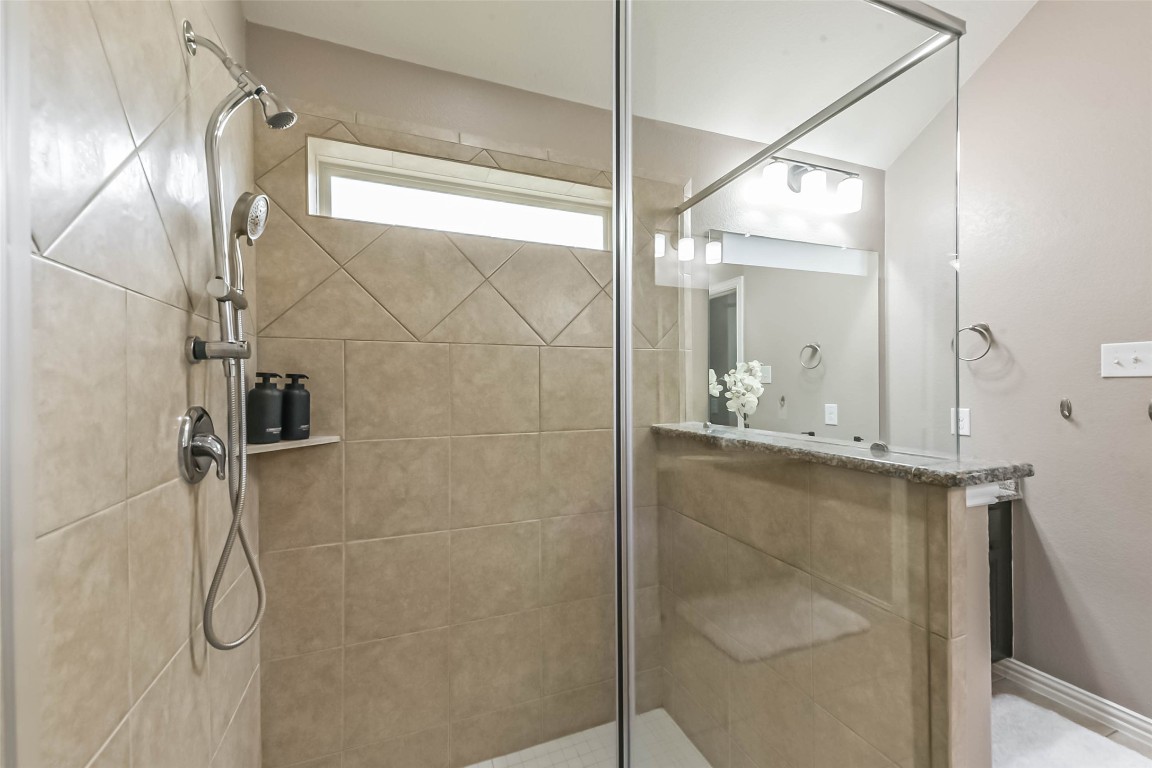 9622 Invergarry Way Tomball, TX 77375 - Photo 22 of 32 a bathroom with a shower and a mirror