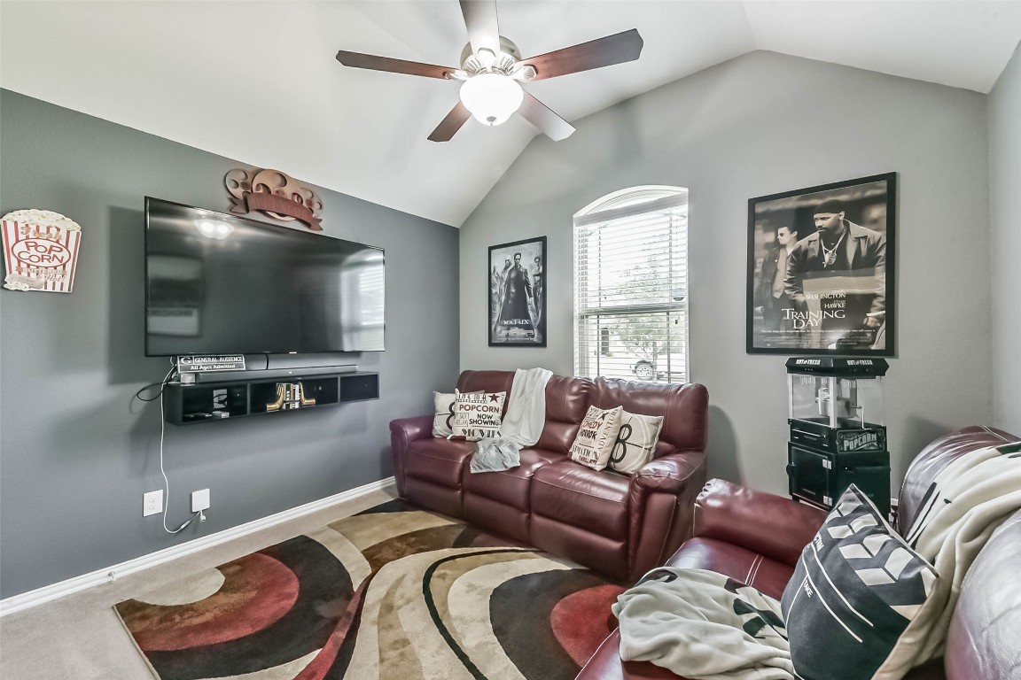 9622 Invergarry Way Tomball, TX 77375 - Photo 26 of 32 a living room with furniture and a flat screen tv