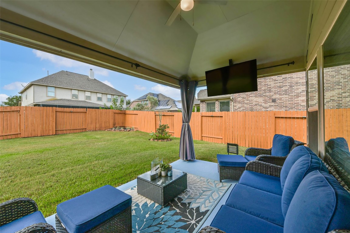 9622 Invergarry Way Tomball, TX 77375 - Photo 28 of 32 a outdoor living space with furniture and garden view